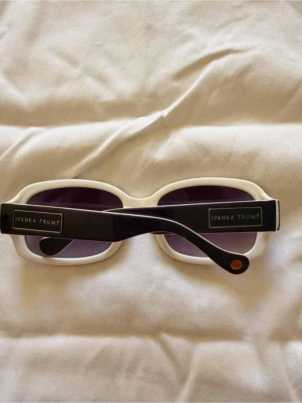 Ivanka Trump White Frame Sunglasses with Black Temples and Purple Lenses